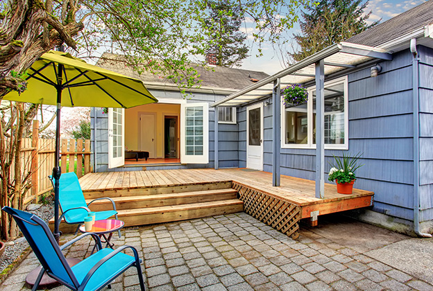 A nice back patio showing doors and windows